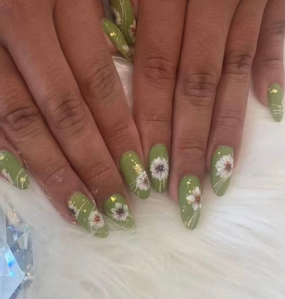 Sage green Japanese gel nails with white floral art and gold accents at Mega Japanese Nail, nail art NYC